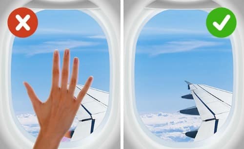 Không nên dựa hay đụng chạm lên cửa sổ máy bay vì đây cũng là nơi chứa nhiều vi khuẩn. Ảnh: top5ivez.