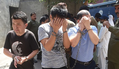 Chinese suspects arrested in Pakistan for luring young girls into fake marriages in China. Photo: AFP
