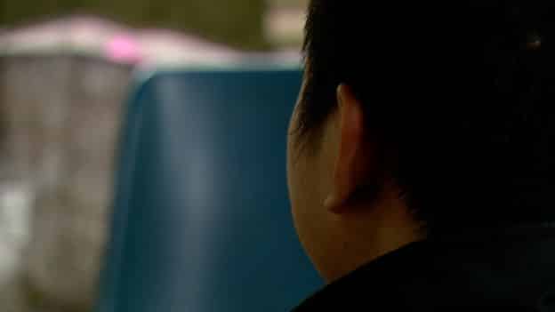 Duc is pictured from behind as he talks to the BBC's Lucy Williamson