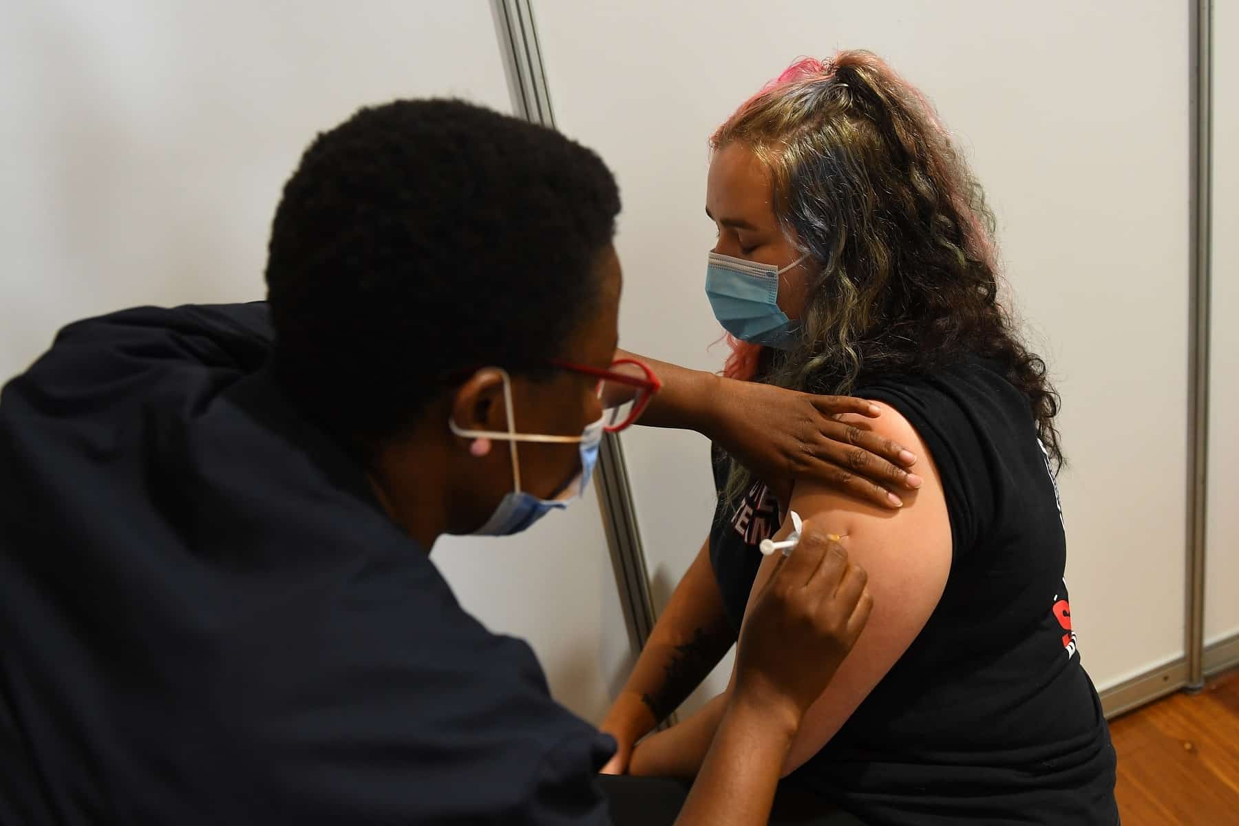 Paramedic Rhiannon Gallatly receives an AstraZeneca COVID-19 vaccination in Melbourne