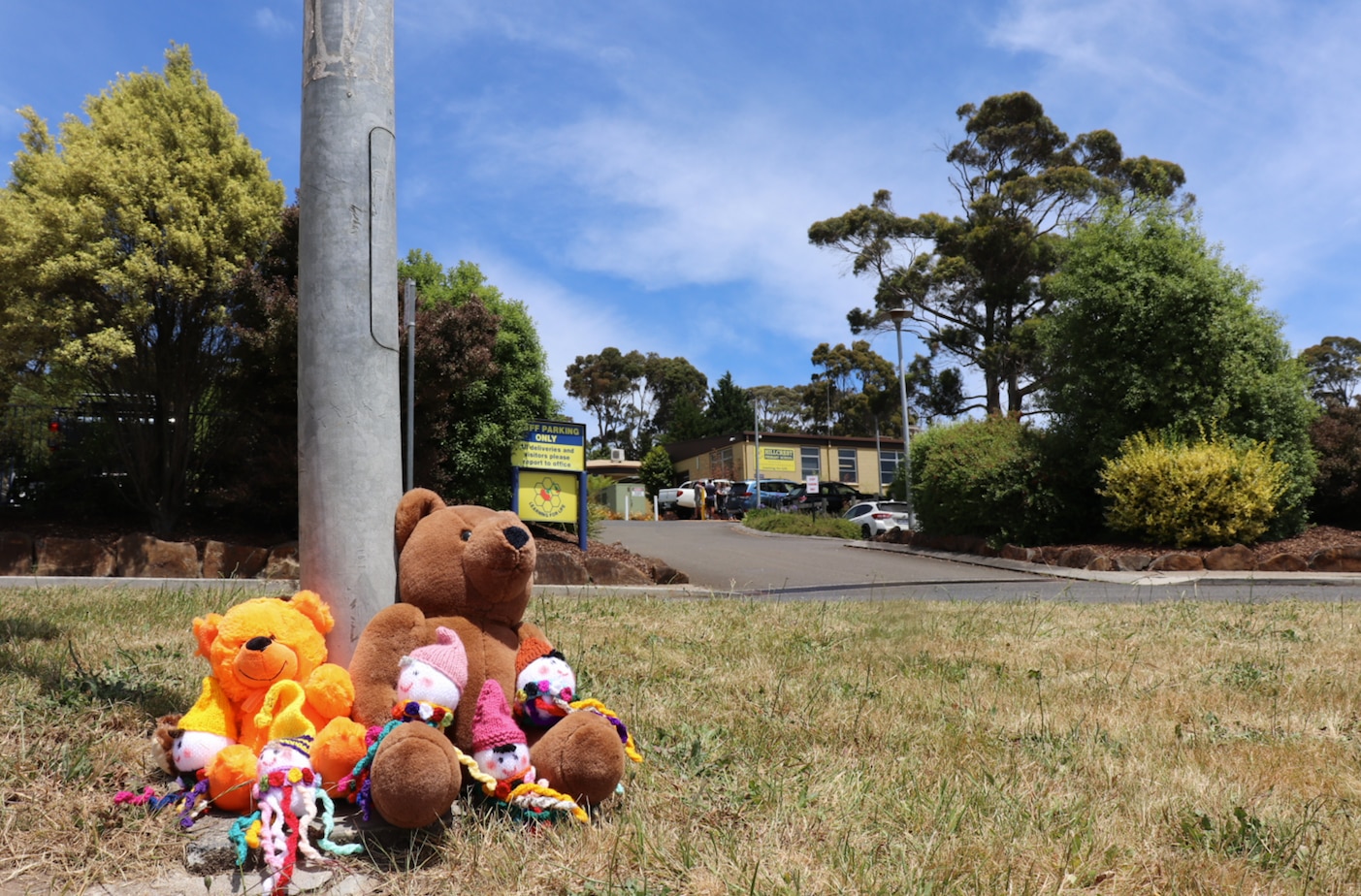 Flowers and tributes are seen outside Hillcrest Primary School in Devonport, Tasmania, Friday, 17 December, 2021. 